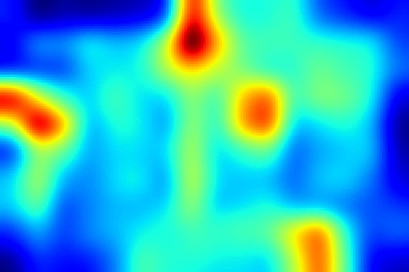 A saliency heat map in blue through red, with three hot spots resolving out of a cool field